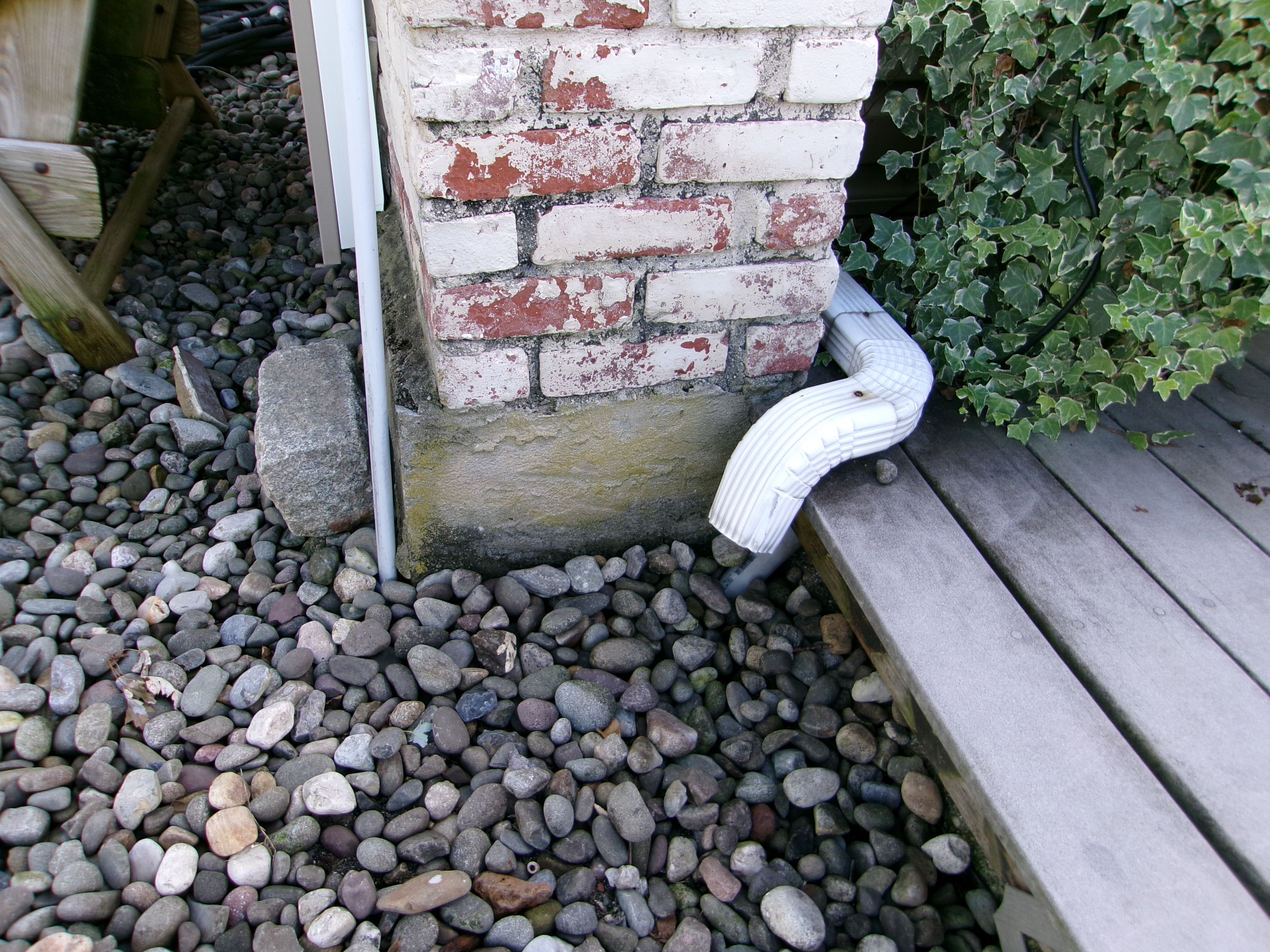 Foundation and drainage inspection – downspout, grading, and moisture control